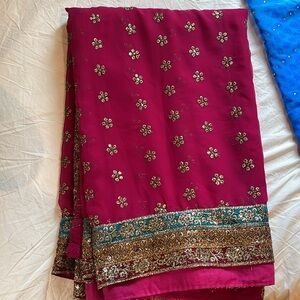 Dark pink sari with gold work